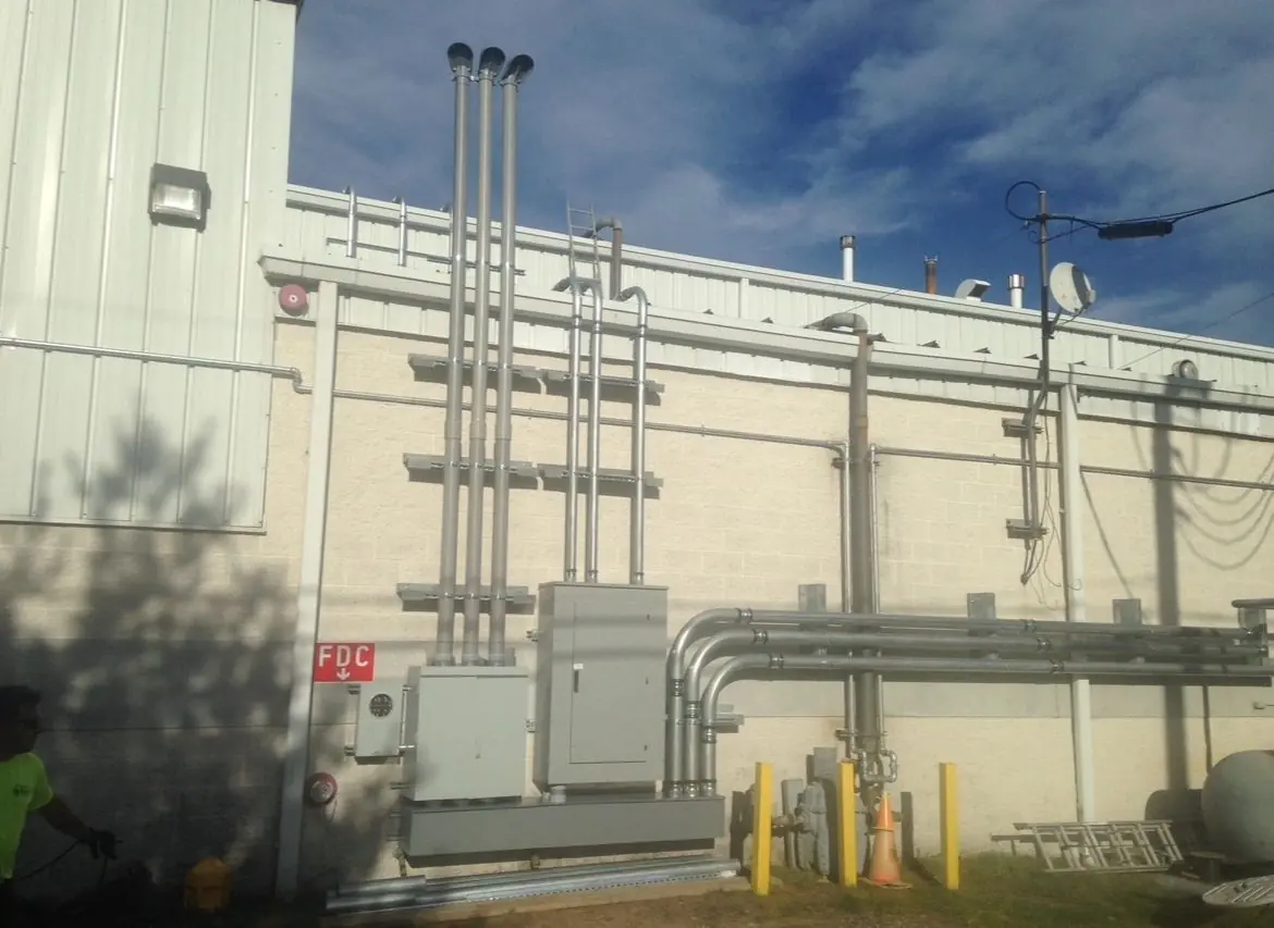 Exterior conduit and electrical equipment on a commercial building