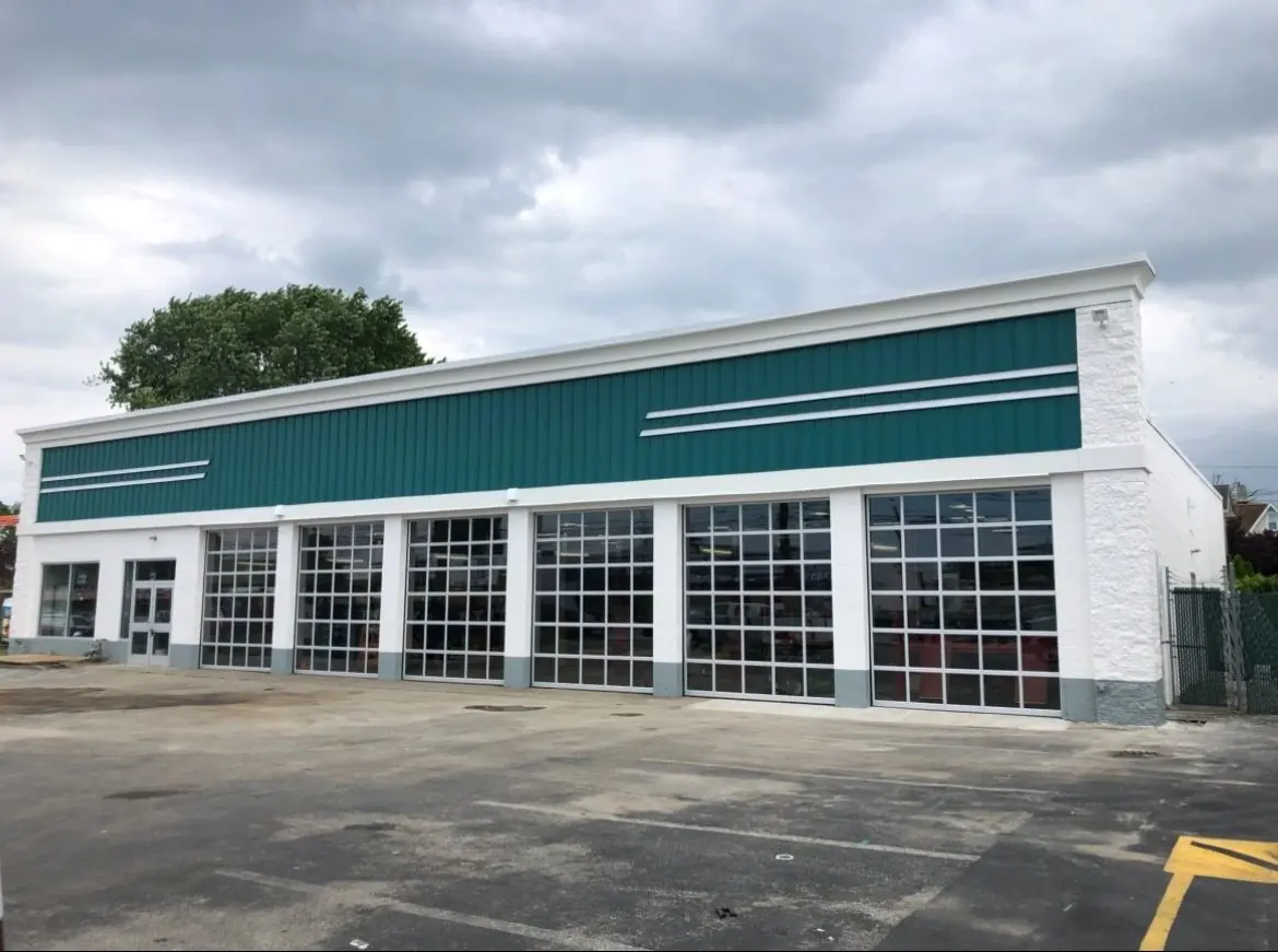 Commercial building with garage bays and new exterior lighting